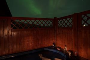 Cottage under northern lights