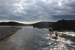 Bathing in thermal river from volcanic area of Holuhraun