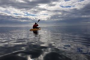 Enjoy paddling on a sit-on-top kayak by the shore