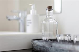 Room with shared bathroom with hand basin