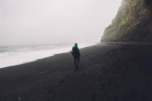 Hiking in black sand beach Iceland