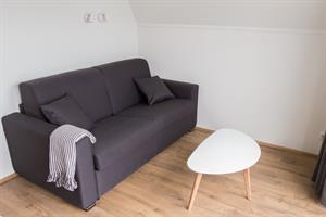 The bigger cottage: Sofa bed in the living room, ideal for the children.