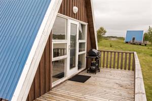 The bigger cottage is with one double room and sofa bed in the living room - ideal for families