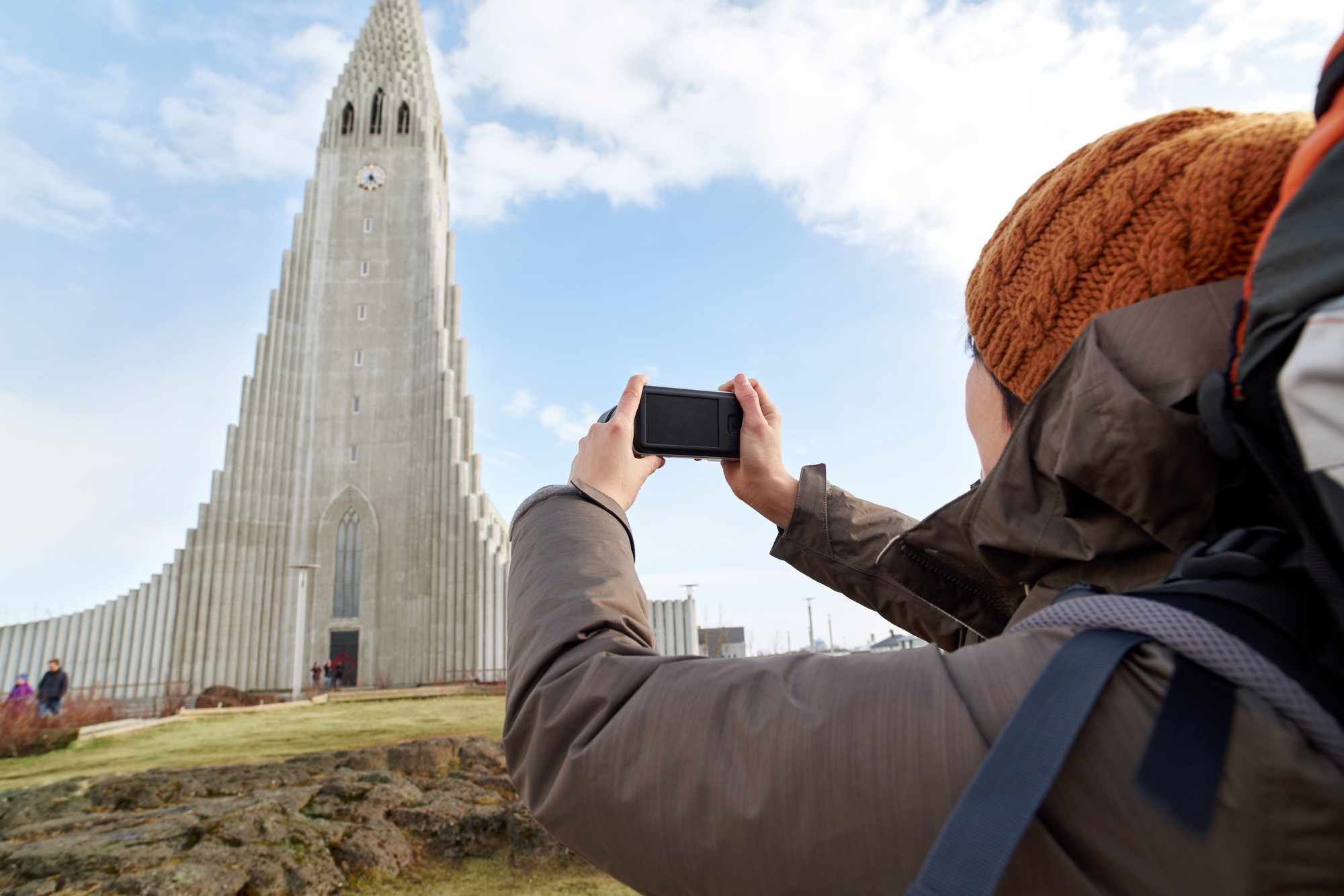 Woman photographing Hallgrímskirkja Church