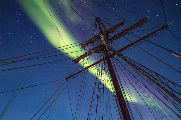 Northern Lights gazing on a sailboat