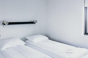 Superior Cottage (37m2): One bedroom with twin beds. Sofa bed is in the living room.