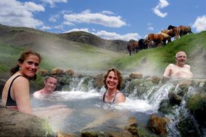 Relaxing in the hot river during the Hot Springs Tour