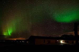 Northern lights over guesthouse Langaholt